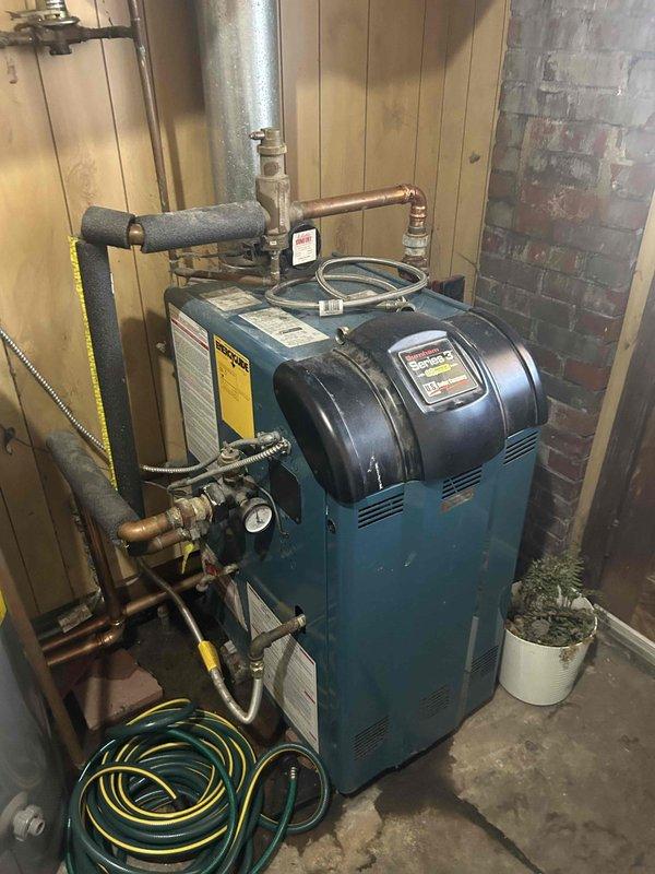 Diagnosed and identified a malfunctioning high temperature limit switch/sensor on the blue residential boiler system. Documented the current condition of the system with detailed photos, noting the issue affects water temperature. Customer was not present during inspection; repair options are pending approval.