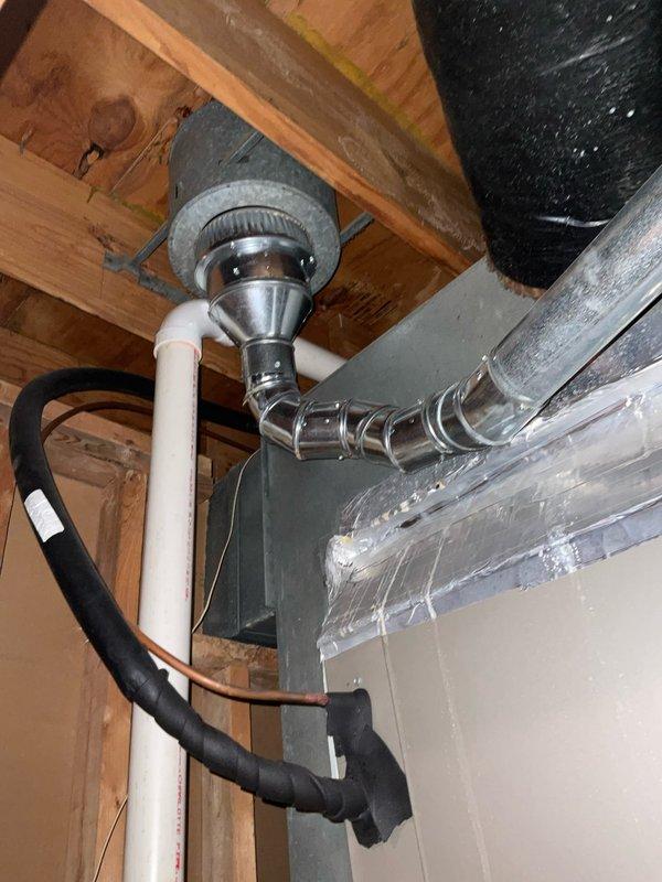 Conducted site inspection for potential AC unit relocation as requested by customer. Evaluated current HVAC system, including furnace installation, ductwork configuration, and drainage components. Documented existing mechanical room setup with exposed joists and fiberglass insulation to assess feasibility of moving outdoor condensing unit to opposite side of residence.