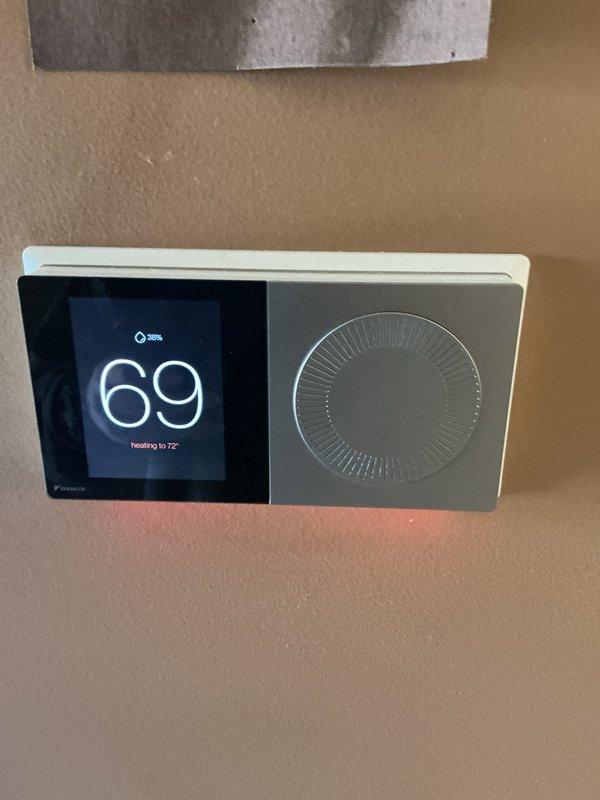 Completed annual cooling maintenance on customer's HVAC system. Inspected internal components including refrigerant lines and electrical connections. System was found operating at 69°F with heating set to 72°F; thermostat functioning properly with 38% humidity reading.