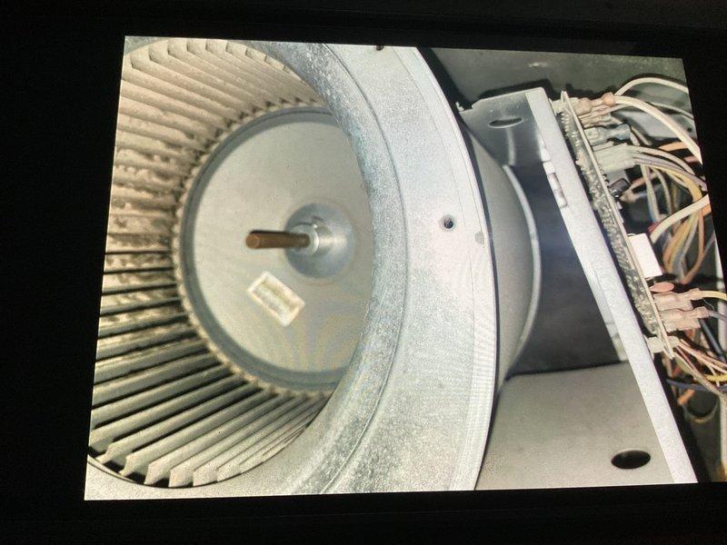 Performed basic monthly maintenance on CCC heat system. Inspected and documented condition of blower wheel assembly showing dust accumulation on fan blades. Examined ductwork which displayed normal wear with some discoloration around fastening points. Filter size was not determined during this visit.