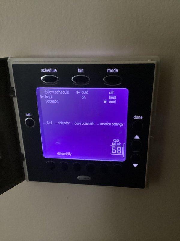 Performed routine 6-month cooling maintenance service on residential HVAC system. Inspected and verified proper operation of Carrier programmable thermostat, confirming correct temperature settings and schedule functionality. System was tested in cooling mode and is operating normally with current temperature set to 68°F.