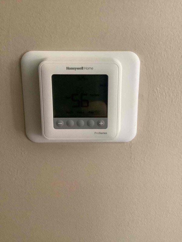 Diagnosed system issue by inspecting the Honeywell Home ProSeries thermostat which was displaying "55" and removed a relay/contactor for examination. Identified faulty electrical component and replaced it to restore proper system operation.