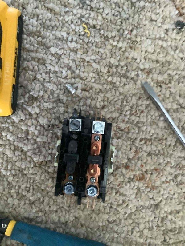 Diagnosed system issue by inspecting the Honeywell Home ProSeries thermostat which was displaying "55" and removed a relay/contactor for examination. Identified faulty electrical component and replaced it to restore proper system operation.