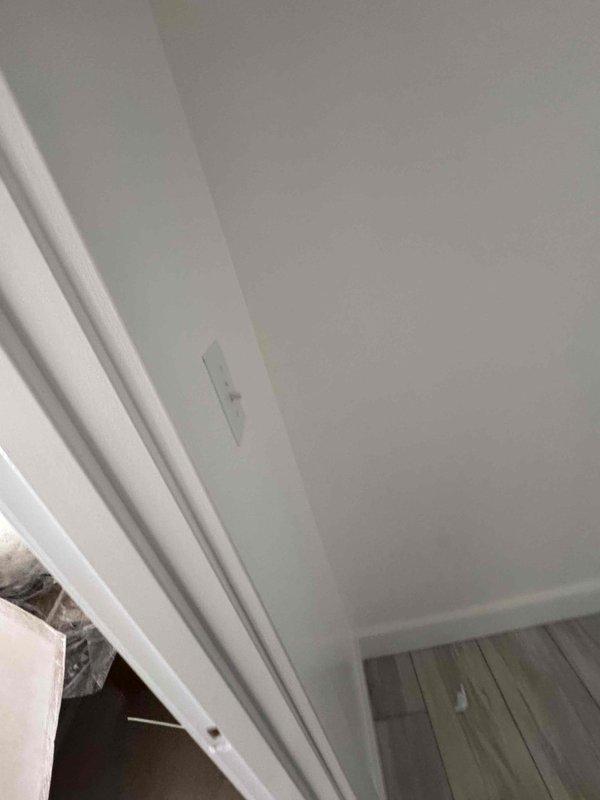 Completed installation of smoke detectors and finished various electrical components in new construction including dining room outlets, kitchen outlets behind stove/backsplash, and dryer electrical connections. Installed lighting fixtures including front porch recessed lights, back porch light, and bathroom light/exhaust fan units in master and guest bathrooms.