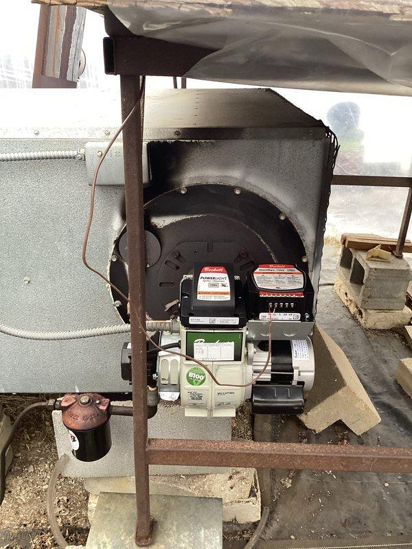 Responded to callback for boiler exhibiting black smoke emissions after warm-up period. Inspected deteriorated cast iron exhaust components and burner assembly with green control module. Adjusted fuel-air mixture settings to correct incomplete combustion issue, eliminating smoke production during operation.