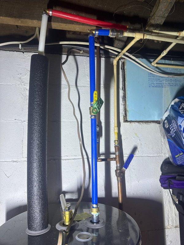 Conducted scheduled plumbing inspection for prepaid maintenance visit. Examined basement plumbing system including water heater connections, supply lines with valves, and drainage infrastructure. Identified condensation issues on PVC pipes in crawl space area where moisture is accumulating on pipes mounted against wooden structural members; documented with photos for future reference.