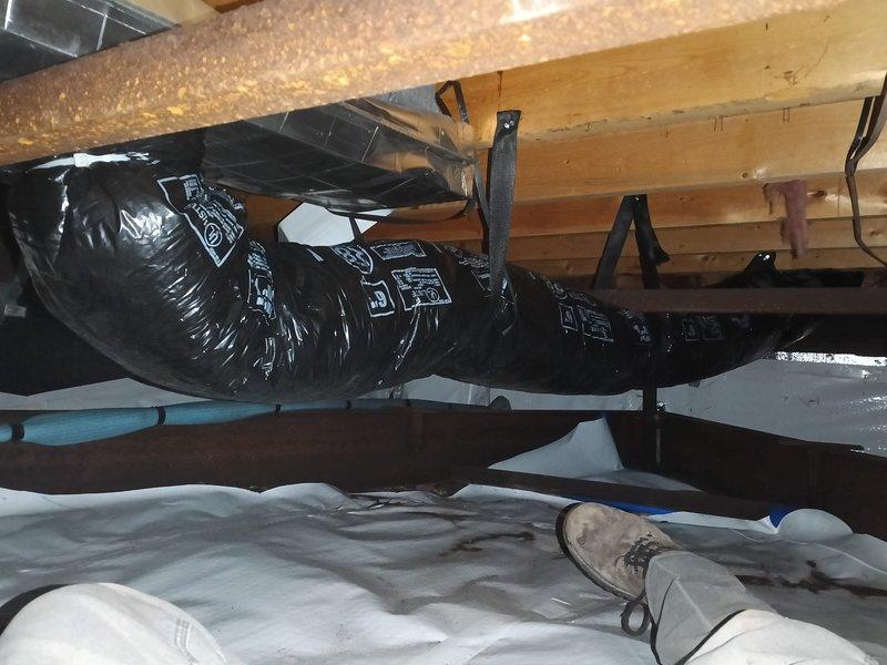 Completed installation of 6-inch flexible ductwork per approved quote, relocating an office duct closer to wall and adding new duct run to bedroom. Accessed crawlspace to properly secure insulated black flex ducts to wooden joists, and installed vapor barrier to ensure system efficiency and proper airflow distribution.