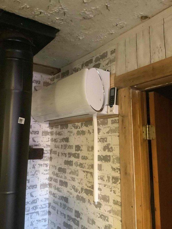Performed second opinion assessment on customer-installed Tosot mini-split system that stopped functioning properly after initial installation. Inspected the system components including the indoor wall unit and refrigerant line connections. Previous service provider had diagnosed a refrigerant (R410A) leak but declined to complete repairs; verified this assessment and documented the current condition for potential repair or replacement options.