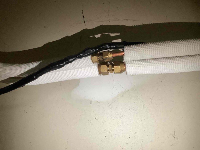 Performed second opinion assessment on customer-installed Tosot mini-split system that stopped functioning properly after initial installation. Inspected the system components including the indoor wall unit and refrigerant line connections. Previous service provider had diagnosed a refrigerant (R410A) leak but declined to complete repairs; verified this assessment and documented the current condition for potential repair or replacement options.