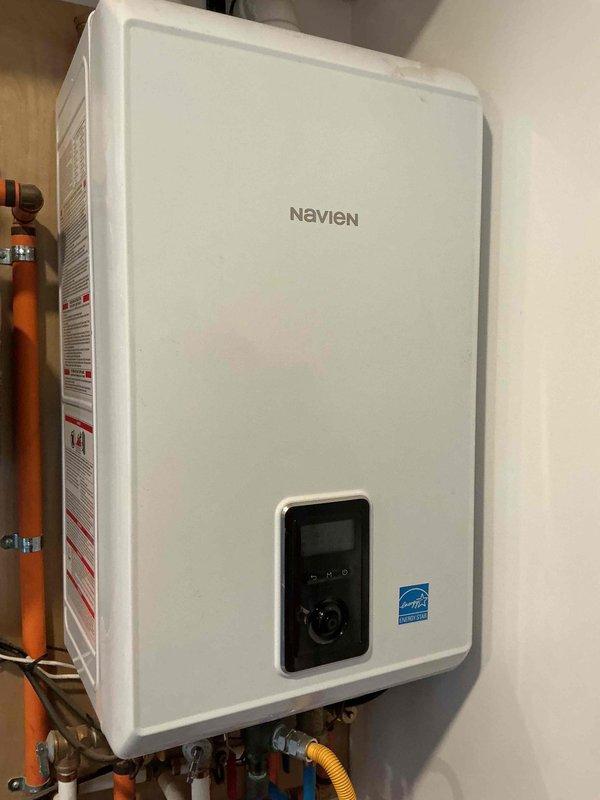 Responded to callback for Navien tankless water heater with reported insufficient hot water supply. Upon inspection, performed system diagnostic and maintenance flush to remove mineral buildup in heat exchanger. Verified proper gas pressure and water flow rates, confirming unit is now operating at optimal efficiency.