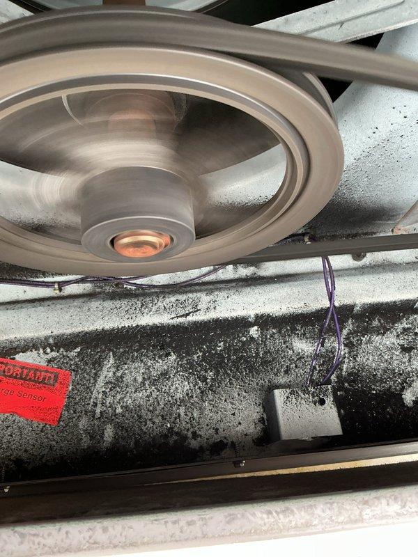 Performed routine maintenance on heating system, inspecting belt drive components and blower assembly. Noted dust accumulation on housing and pulley system, with belt showing normal wear. Documented filter requirements for future service: 12 (16x20x2), 4 (18x25x2), 12 (20x20x2), and 4 (16x16x2) filters needed; CCH Basic coverage extends until 05/21/2028.