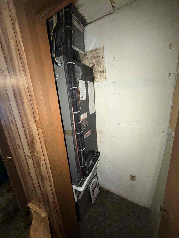 Successfully installed a complete Lennox Heat Pump System for residential application. Positioned company identification on property during service. Installed indoor air handler/furnace unit in utility area with proper connections to existing ductwork and electrical systems.