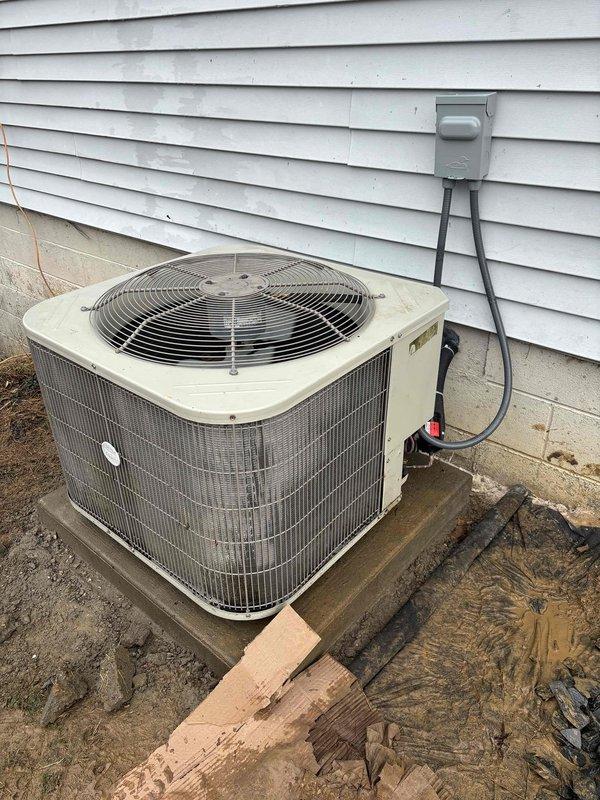 Successfully relocated customer's AC condensing unit from the rear of the residence to the left side of the house. Installation included mounting the unit on a concrete pad, connecting electrical service via properly installed disconnect box, and routing necessary refrigerant lines through the basement ceiling joists. Unit was tested and confirmed to be operating within manufacturer specifications after relocation.