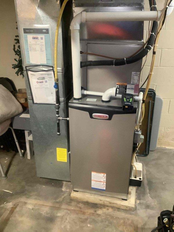 Performed annual heating maintenance on Lennox furnace system. Replaced 14x20x1 filter as included in maintenance agreement. Documented water heater and furnace condition with photos for system records.