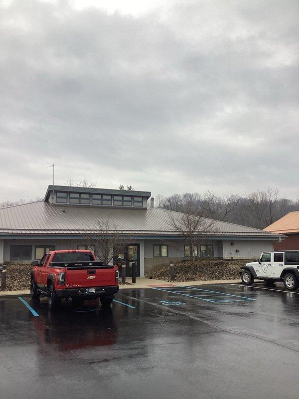 Responded to emergency water alarm activation at commercial property. Discovered water accumulation on floor beneath HVAC condensate drain system. Inspected galvanized metal housing and PVC drainage pipes, identified blockage in primary condensate line causing overflow. Cleared obstruction, verified proper drainage function, and confirmed system operation before departure.