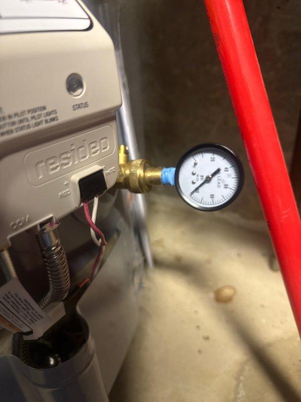 Responded to service call for water heater leaking from temperature and pressure relief valve overflow, which had been dripping consistently for over a week. Inspected system and found pressure regulator functioning improperly, causing excessive pressure in the water heater. Adjusted pressure regulator to proper PSI range and verified normal operation of the T&P valve with no further discharge.