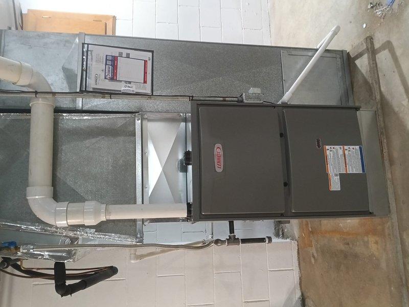 Successfully installed a Lennox gas furnace in the utility area with proper connection to existing ductwork. Installed white PVC exhaust piping and ensured proper labeling of the cold air return. Completed all installation requirements and documented with verification photos of the finished system.