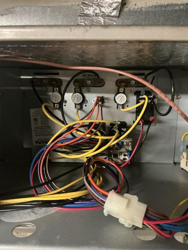Performed monthly Basic Plus maintenance on Carrier CCHP-Heating system. Inspected control board components including thermostats, limit switches, and wiring connections. Verified proper operation of Carrier Infinity Touch thermostat displaying normal temperature readings and system functionality.