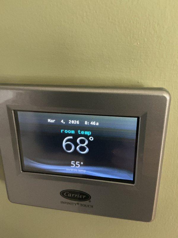 Performed monthly Basic Plus maintenance on Carrier CCHP-Heating system. Inspected control board components including thermostats, limit switches, and wiring connections. Verified proper operation of Carrier Infinity Touch thermostat displaying normal temperature readings and system functionality.