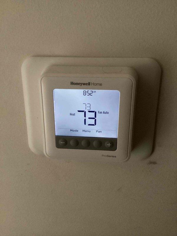 Performed routine maintenance on CCHP heating system. Replaced expired 20x20x1 KOCH air filter (included with service). Verified proper operation of Honeywell ProSeries thermostat with heat mode functioning correctly at 73°F.