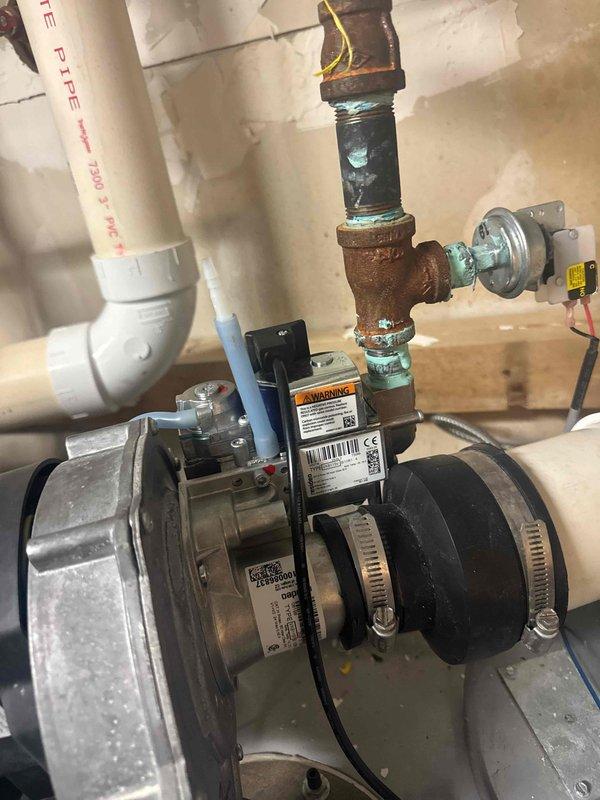 Returned to property to replace corroded gas valve on water heater system. Removed existing brass valve assembly that showed significant oxidation and green patina formation. Installed new gas valve and verified proper connections to copper piping, ensuring system integrity and safe operation.