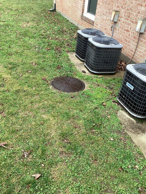 Conducted camera inspection of drain system at unit B to investigate suspected clogged line. Found catch basin heavily obstructed with mud, sediment, and debris, preventing proper drainage. Documented condition of exterior drainage access point for follow-up regarding previously identified manhole issue.