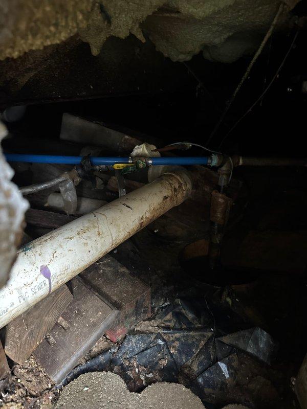 Responded to emergency call for a burst pipe near the shut-off valve in a mobile home. Accessed confined crawlspace to locate the damaged section where PVC and PEX lines connect. Replaced the failed valve assembly and verified system integrity with pressure test after repair.