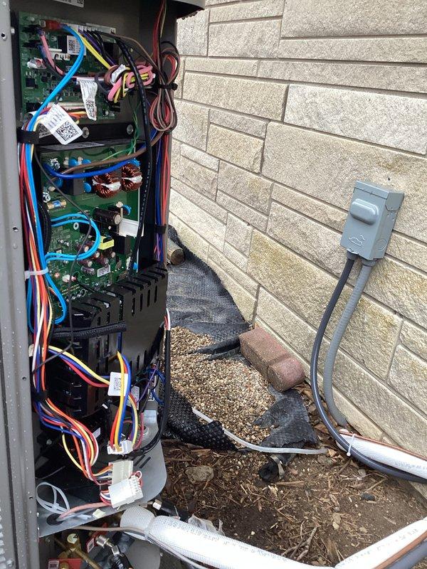 Performed annual maintenance service on Lennox CCHP heating system (renewal due 8/10/27). Inspected and verified proper operation of thermostat interface showing normal temperature readings and system response. Examined control board connections and wiring at exterior disconnect panel, confirming all components were properly secured and functioning. Replaced air filter as part of scheduled maintenance protocol.