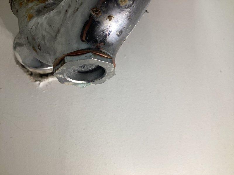 Diagnosed and repaired leaking bathroom sink faucet exhibiting slow drip. Inspection revealed corroded internal components and mineral buildup on chrome fixtures, particularly at connection points. Replaced worn seals and adjusted fittings to restore proper function and eliminate leak.