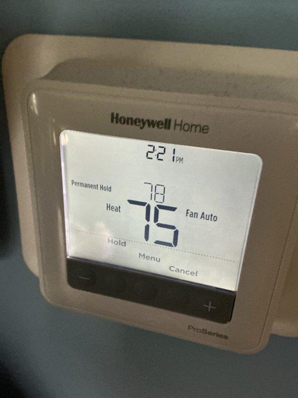 Performed scheduled maintenance on two heating systems. Inspected 605 water heater in utility area, confirming proper connections and operational status. Checked Honeywell ProSeries thermostat, verified heat mode functioning correctly with temperature holding steady at 75°F, and replaced standard 20x25x4 filter as part of monthly maintenance agreement.