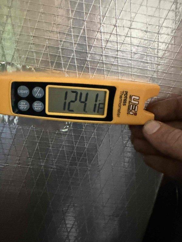 Successfully installed a Lennox 80% Gas Furnace in utility room with proper ductwork connections and transition box extending to ceiling area. Verified system operation with temperature readings showing 124.1°F at supply plenum, confirming proper heat exchange. Installation completed with all necessary gas line connections and safety checks performed.