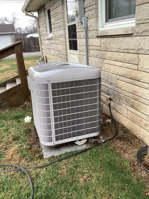 Performed routine cooling maintenance service on a residential central air conditioning system. Inspected outdoor condenser unit installed on concrete pad, verified proper refrigerant lines and electrical connections to the house. System appears to be in normal operating condition with no visible issues noted.