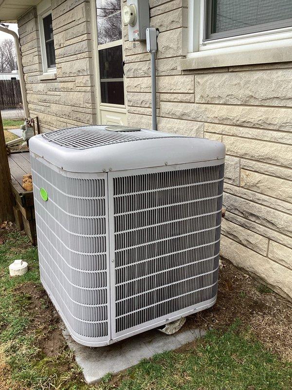 Performed routine cooling maintenance service on a residential central air conditioning system. Inspected outdoor condenser unit installed on concrete pad, verified proper refrigerant lines and electrical connections to the house. System appears to be in normal operating condition with no visible issues noted.