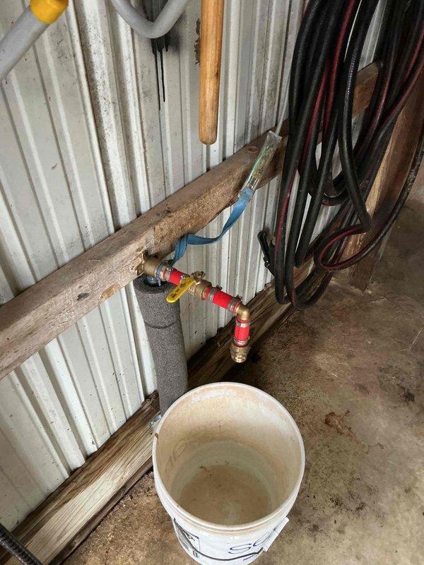 Responded to service call regarding leaking ball valve on outdoor water line previously serviced. Inspection revealed the brass valve assembly on the copper pipe system was leaking at connection point. Replaced faulty ball valve and verified proper operation with no leaks present.