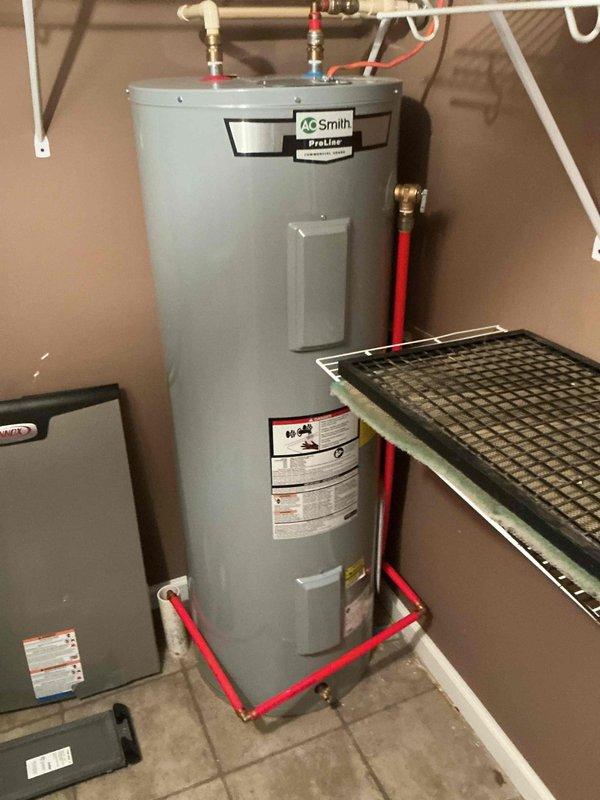 Completed scheduled annual heating maintenance service on residential HVAC system (rescheduled from previous date). Performed comprehensive inspection of furnace unit with access panel removed to examine internal components, wiring, and electronic controls. System includes A.O. Smith ProLine water heater with proper pipe insulation and ventilation. All components functioning normally with no issues identified.