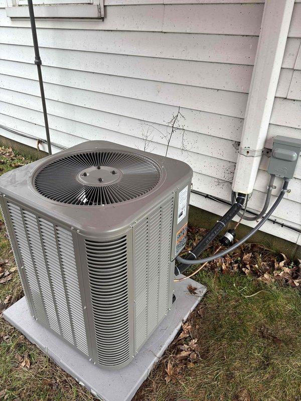 Successfully installed a complete HVAC system consisting of a new Lennox air conditioning unit and gas furnace. Mounted the AC condenser on a concrete pad with proper electrical and refrigerant line connections to the house, and installed a Honeywell Home FocusPRO P200 programmable thermostat with new batteries for system control.