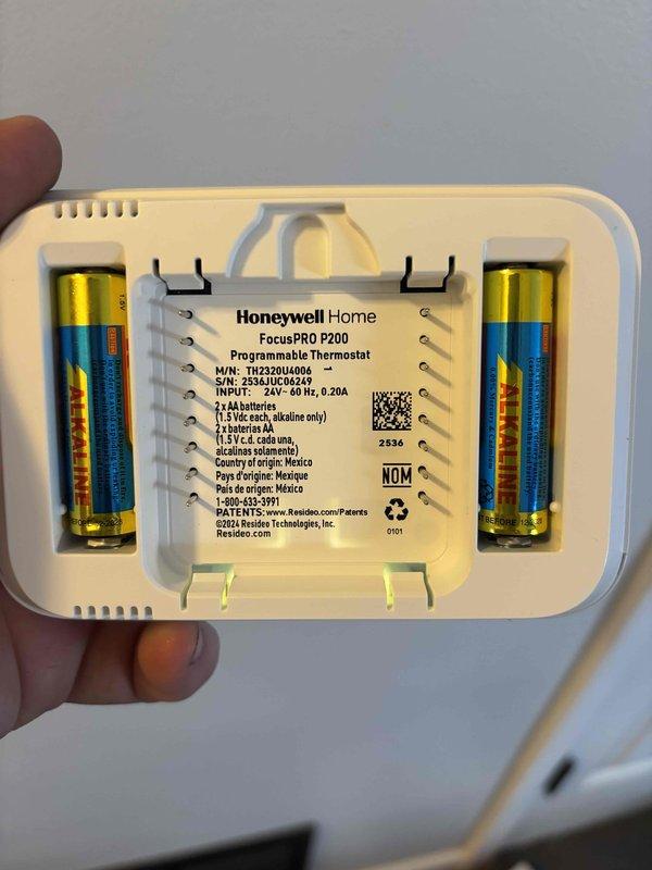 Successfully installed a complete HVAC system consisting of a new Lennox air conditioning unit and gas furnace. Mounted the AC condenser on a concrete pad with proper electrical and refrigerant line connections to the house, and installed a Honeywell Home FocusPRO P200 programmable thermostat with new batteries for system control.