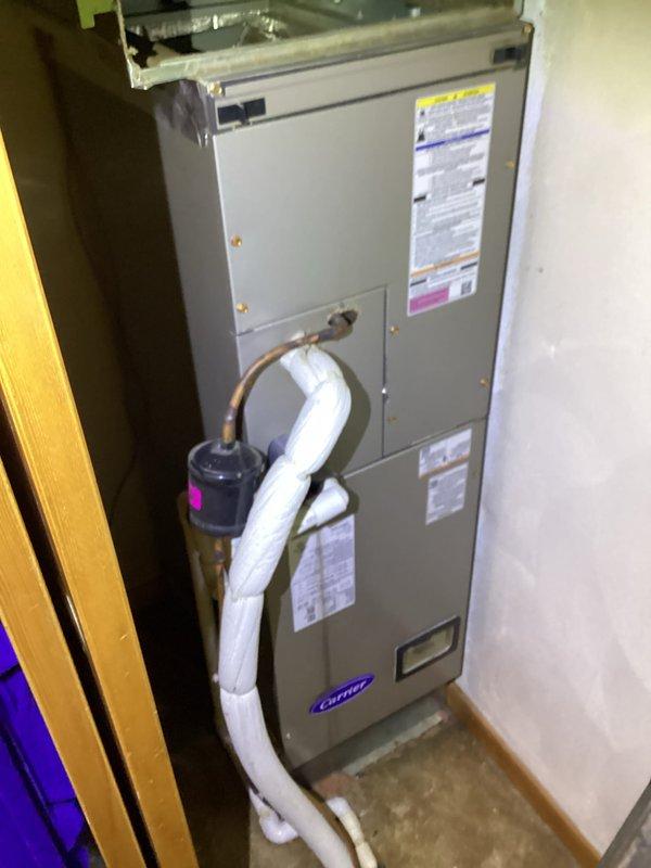 Completed monthly basic maintenance service on Carrier HVAC heating system. Inspected furnace unit including condensate drain line, pump connections, and operational components. Verified thermostat functionality with system properly maintaining 70°F setpoint in Auto Heat mode.