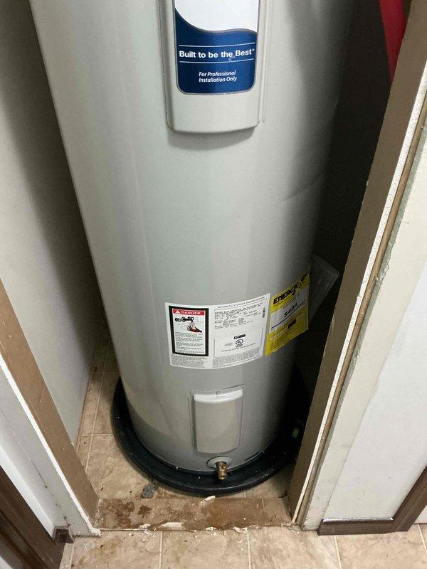 Responded to service call for a water heater with no hot water issue that had persisted for some time. Upon inspection of the cylindrical tank water heater installed in a utility closet, identified operational failure. Restored hot water functionality to the residential system, ensuring proper temperature regulation and performance.