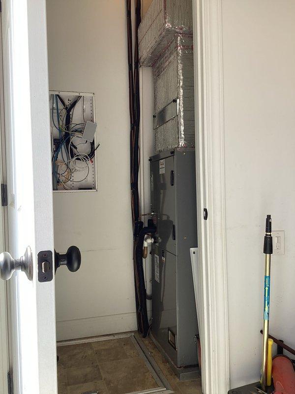 Performed scheduled basic monthly heating maintenance on three HVAC systems. Inspected digital thermostat functionality with readings of 73°/70° and examined mechanical closet housing the furnace unit, ensuring proper operation of all components and connections.