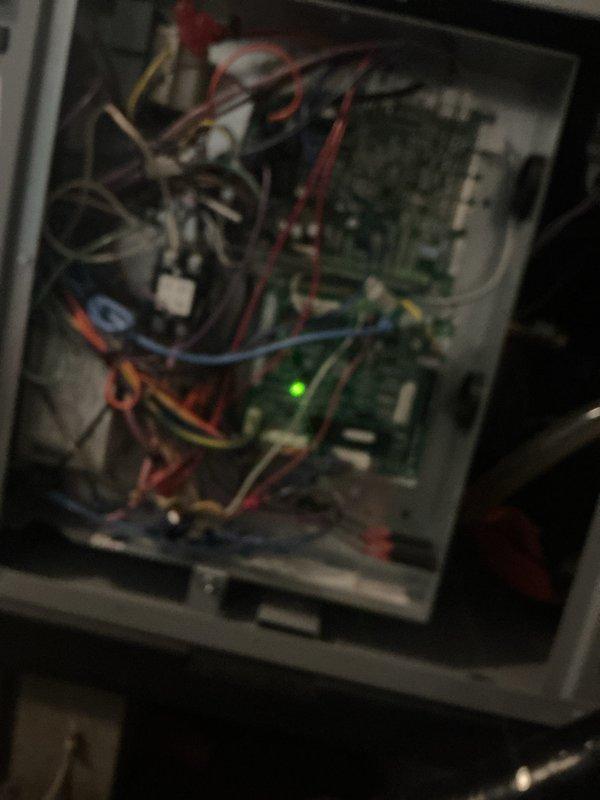 Completed scheduled monthly maintenance on heating system. Inspected control panel wiring and electronic components, noting all connections secure with green indicator light functioning properly. Replaced 20x30x2 air filter with new unit as part of routine service.