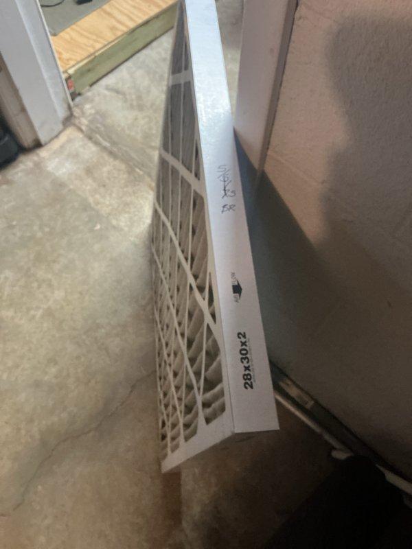 Completed scheduled monthly maintenance on heating system. Inspected control panel wiring and electronic components, noting all connections secure with green indicator light functioning properly. Replaced 20x30x2 air filter with new unit as part of routine service.
