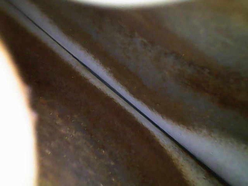 Performed diagnostic inspection on 10+ year old heating system that revealed significant rust and corrosion on heat exchanger components. Visual examination confirmed advanced oxidation at critical junction points, indicating moisture exposure and long-term deterioration. Recommended full system replacement due to safety concerns and compromised operational integrity.