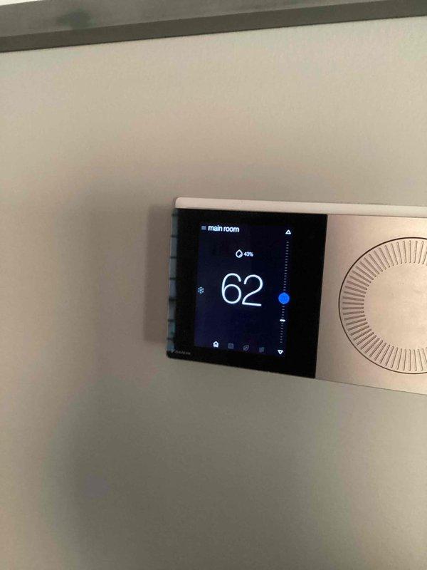 Performed scheduled cooling system maintenance on an HVAC system with thermostat operating at 62°F. Verified proper thermostat functionality with the cooling mode active as indicated by the snowflake icon. Observed humidity level at 43%, which is within acceptable parameters for residential cooling operation.