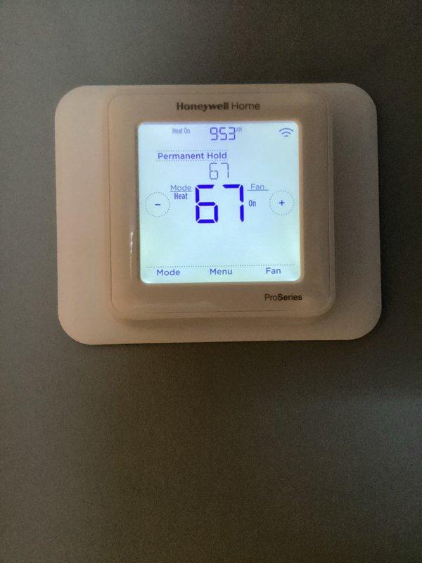 Performed routine cooling maintenance and diagnosed communication issue with Honeywell ProSeries thermostat displaying "contact dealer" error. Inspected system components including furnace and water heater to verify proper operation. Thermostat showing incorrect temperature readings (95.3°) while set to 67° with heat mode active; recommended thermostat replacement to resolve communication failures.