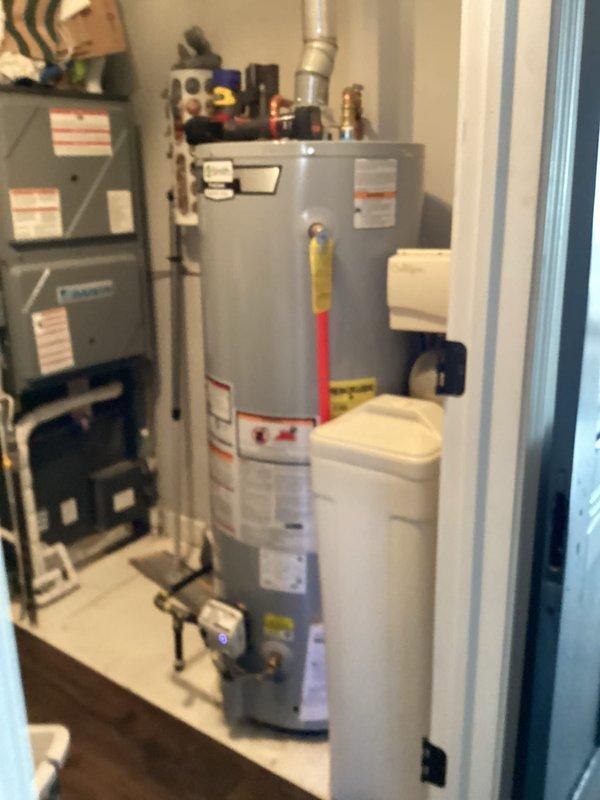 Performed routine cooling maintenance and diagnosed communication issue with Honeywell ProSeries thermostat displaying "contact dealer" error. Inspected system components including furnace and water heater to verify proper operation. Thermostat showing incorrect temperature readings (95.3°) while set to 67° with heat mode active; recommended thermostat replacement to resolve communication failures.