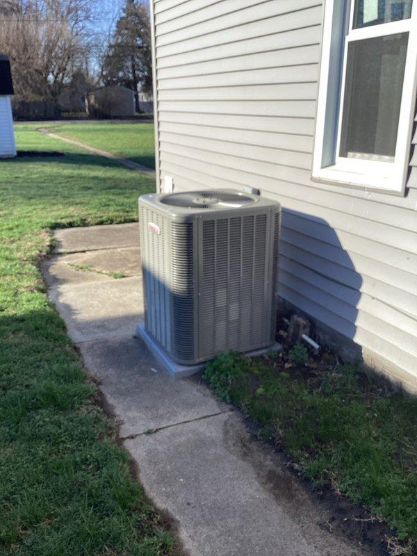 Responded to no-cooling complaint on residential air conditioning system. Inspection revealed significant corrosion and oxidation on refrigerant lines at the outdoor condensing unit. Determined system has developed a refrigerant leak at the copper piping connection, causing insufficient cooling capacity despite fan operation. Photographed damaged components for documentation.