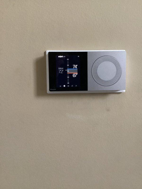 Performed monthly basic heating maintenance service on CCHP system. Verified proper thermostat operation with current temperature at 74° and heating/cooling setpoints at 72°/67°. Inspected exterior Daikin condensing unit, confirming proper installation on concrete blocks with no visible issues.