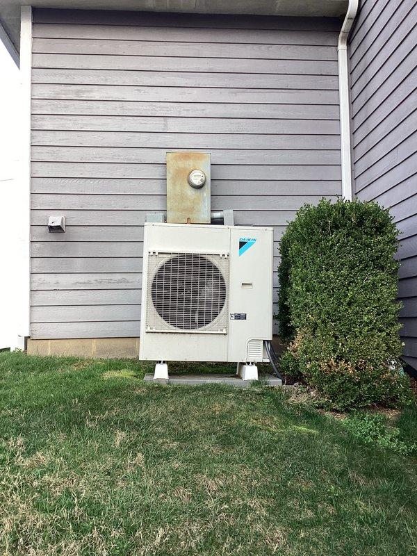 Performed monthly basic heating maintenance service on CCHP system. Verified proper thermostat operation with current temperature at 74° and heating/cooling setpoints at 72°/67°. Inspected exterior Daikin condensing unit, confirming proper installation on concrete blocks with no visible issues.