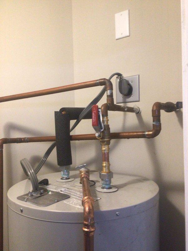 Diagnosed 20-year-old AO Smith Electric 50 Water Heater with active leak causing floor damage. Inspection revealed end-of-life unit with compromised tank integrity, requiring complete replacement to prevent further property damage.